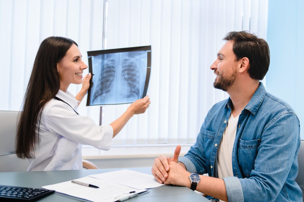 Lung,Disease.,Young,Female,Doctor,Showing,Chest,X-ray,To,Her